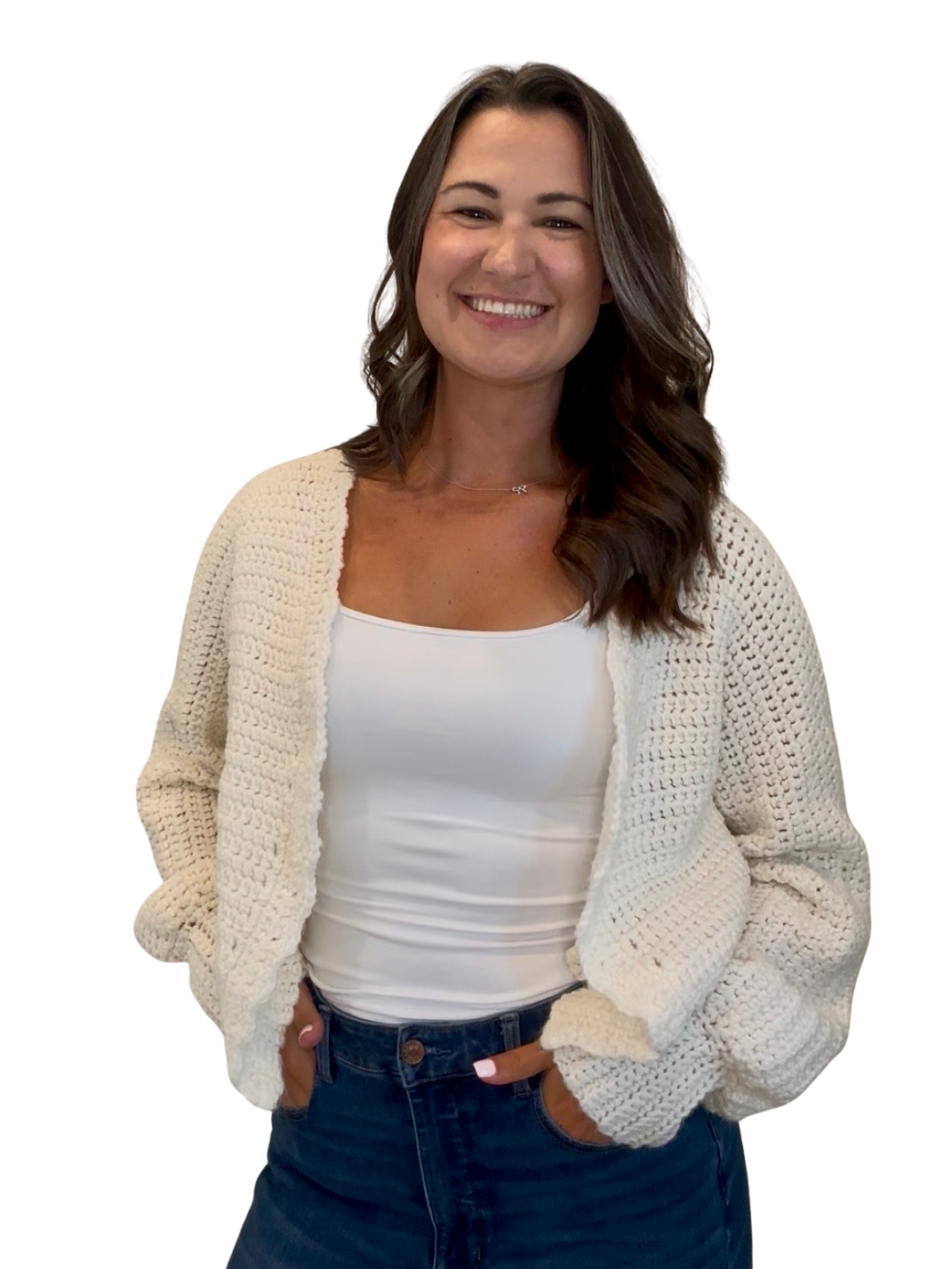 Rebecca Norelli smiling in a cream cardigan